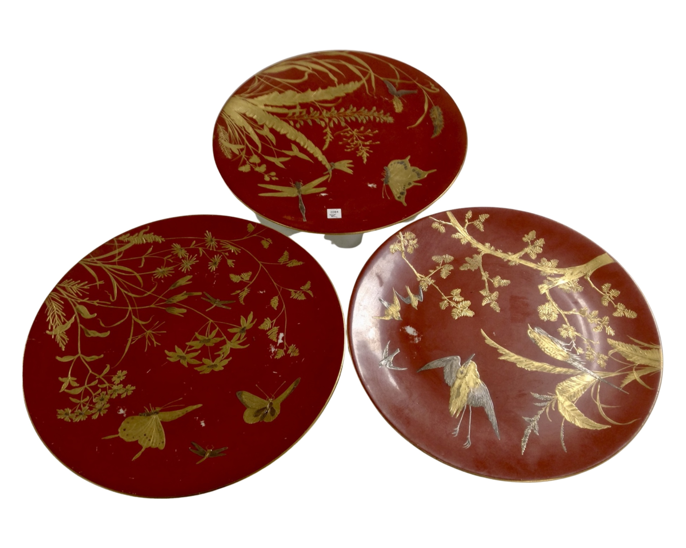 Three Oriental gilded plates.