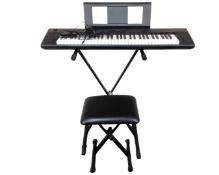 A Yamaha Piaggero NP-12 keyboard on stand with stool with lead and effects pedal