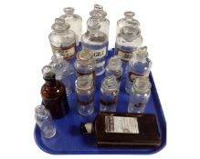 A tray containing assorted chemist's bottles.