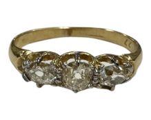An 18ct gold three stone old-cut diamond ring, the total diamond weight estimated at 0.