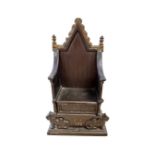 A cast iron money box 'The Imperial Throne', height 21 cm.