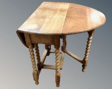 An early 20th century oak barley twist gate leg table., height 74 cm width 74 cm.