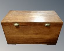 A 19th century mahogany shipping trunk with brass handles, height 59 cm, width 107 cm, depth 55 cm.