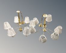A pair of contemporary brass six way light fittings, with shades.