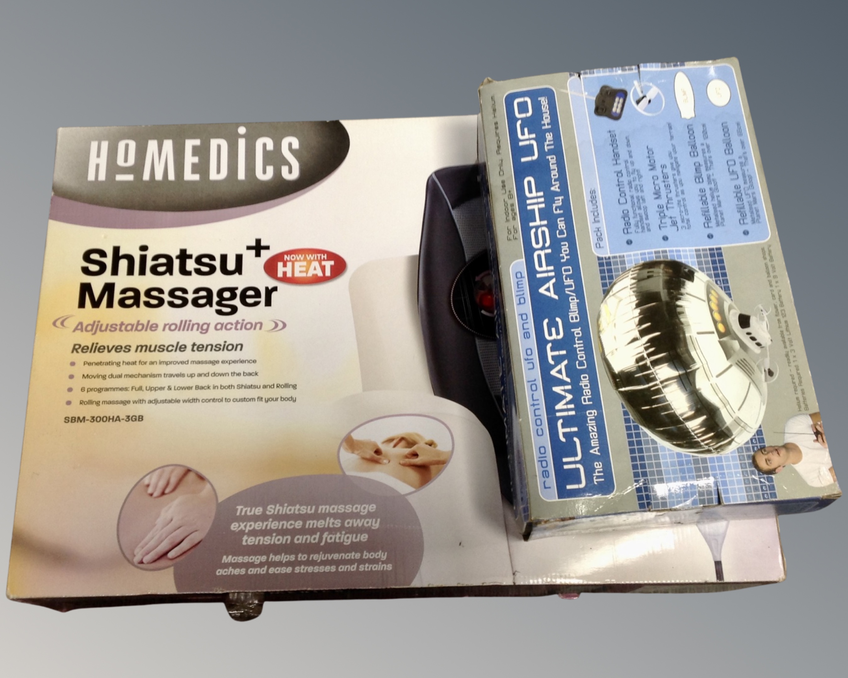 A Homedics Shiatsu massage cushion together with an airship UFO.