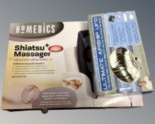 A Homedics Shiatsu massage cushion together with an airship UFO.