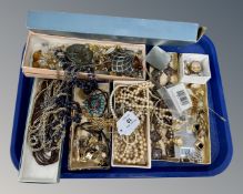 A tray of costume jewellery, earrings, watch,