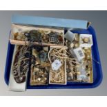 A tray of costume jewellery, earrings, watch,