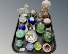 A tray containing two Victorian glass dumps together with a collection of glass paperweights