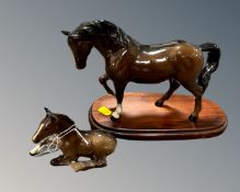 A Beswick figure of a horse on wooden plinth together with a further Beswick figure of a foal.