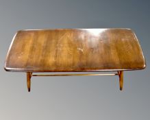 An Ercol stained elm and beech coffee table with undershelf