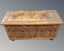 A carved hardwood blanket box.