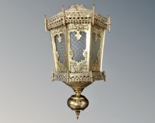An ornate brass Moroccan lantern.