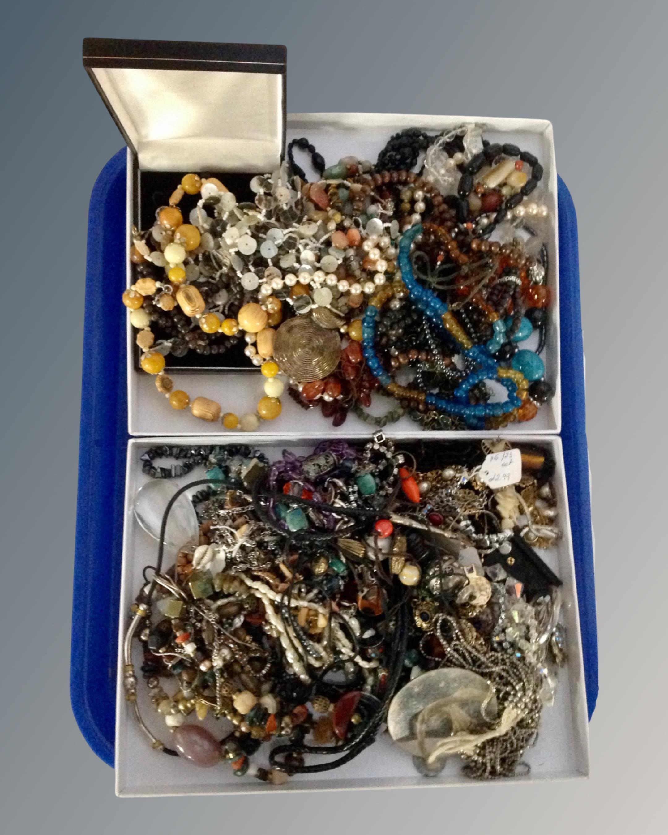 A tray containing a large quantity of costume jewellery.