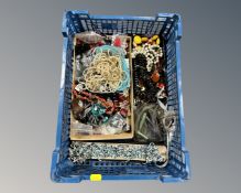 A basket containing a quantity of costume jewellery.