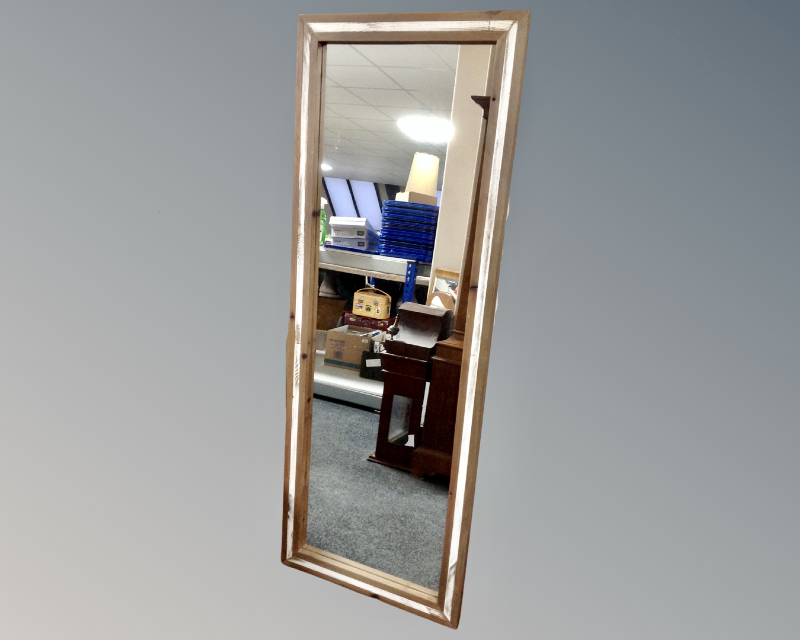 A pine framed hall mirror, 56cm by 150cm.