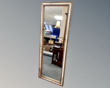 A pine framed hall mirror, 56cm by 150cm.