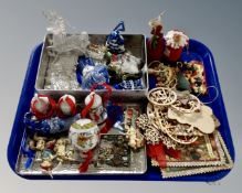 A tray containing a quantity of ceramic glass and wooden Christmas tree decorations.