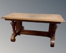 A mahogany and walnut low console table with mirrored back.