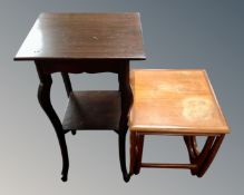 An Edwardian two tier occasional table together with a nest of two mid-20th century teak tables.