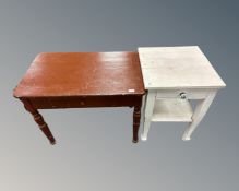 An antique painted pine side table fitted with a drawer together with a further painted two tier