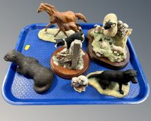 A tray containing five Border Fine Arts animal figures, two on wooden plinths,