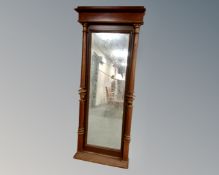 A 19th century mahogany hall mirror with pillar column supports.