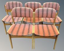 A set of five mid-20th century Danish dining chairs upholstered in striped fabric.