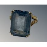 A yellow gold synthetic aquamarine ring, size M.