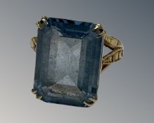 A yellow gold synthetic aquamarine ring, size M.