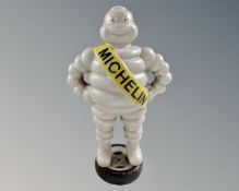 A cast iron Michelin Man figure.