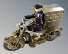 A cast iron Parcel Post delivery man on motorcycle figure.