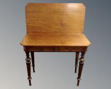 A 19th century mahogany and walnut turnover top tea table.