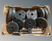A box containing vinyl weights and dumbbell bars.