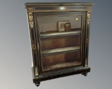 A Victorian ebonised and gilt metal mounted pier cabinet