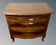 A 19tyh century continental mahogany three drawer bow fronted chest on raised legs.