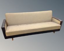 A mid-20th century Scandinavian bed settee upholstered in two tone black vinyl and fabric.