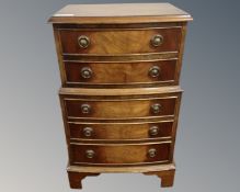 A mahogany five drawer miniature chest on chest.