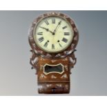 A Victorian rosewood drop dial wall clock with mother of pearl inlay.