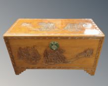 A Chinese carved camphor wood blanket chest.