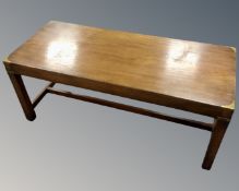 A rectangular mahogany campaign style coffee table with brass mounts.