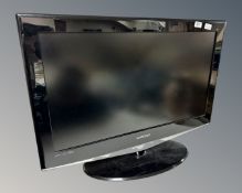 A Samsung 32" LCD TV with lead and remote.