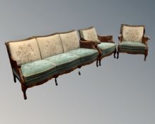 A three piece continental beech and bergere framed lounge suite.