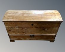 A 19th century pine dome topped shipping trunk fitted with a drawer.
