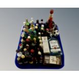 A tray containing assorted alcohol including a bottle of Grand Marnier, Bacardi,