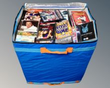 A large storage bag containing a quantity of CDs and DVDs.