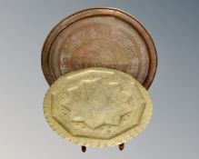 An Indian brass top table on folding stand together with a further brass tray.