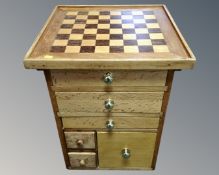 A six drawer chest with chessboard top together with a further chessboard,