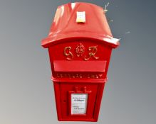 A George VI style red metal post box with keys.