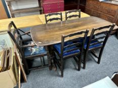 An Ercol elm and beech refectory dining table together with a set of five ladder back chairs,
